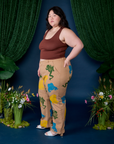 Side view of Paintstamped Work Pants in Froggy and fudgesicle brown Cropped Tank on Ashley