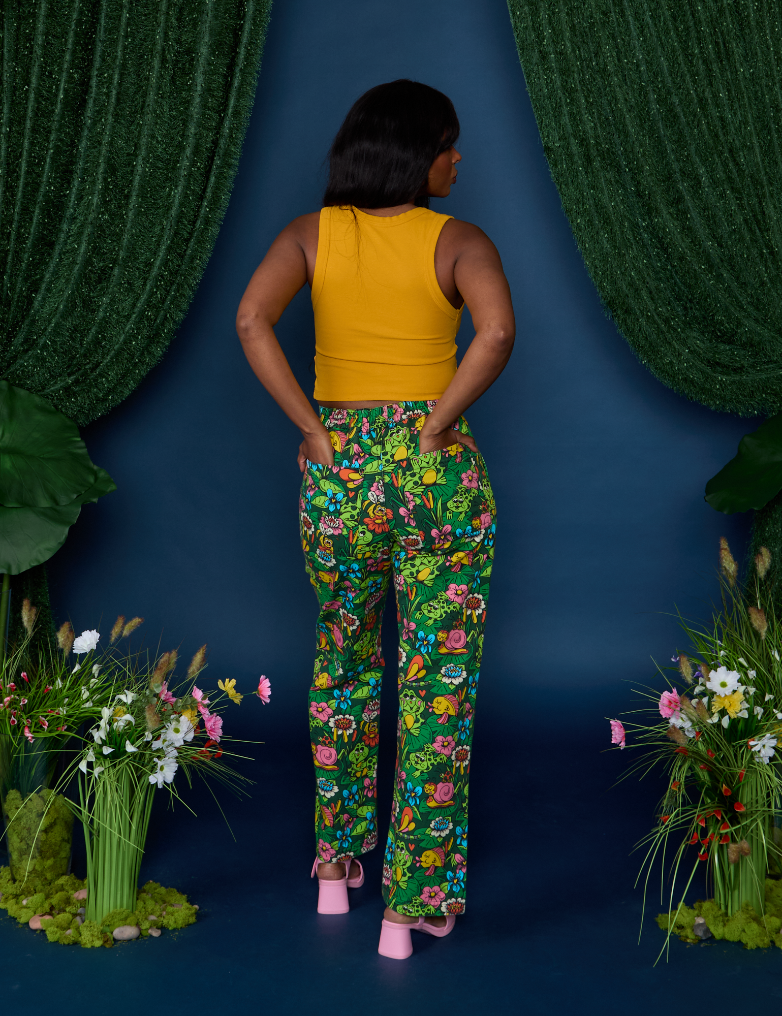 Back view of Work Pants in Pond Party and mustard yellow Cropped Tank on Kandia