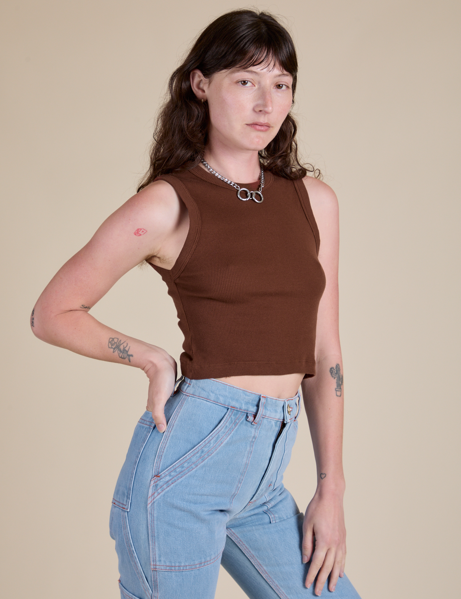 Angled front view of Muscle Tee in Fudgesicle Brown on Alex
