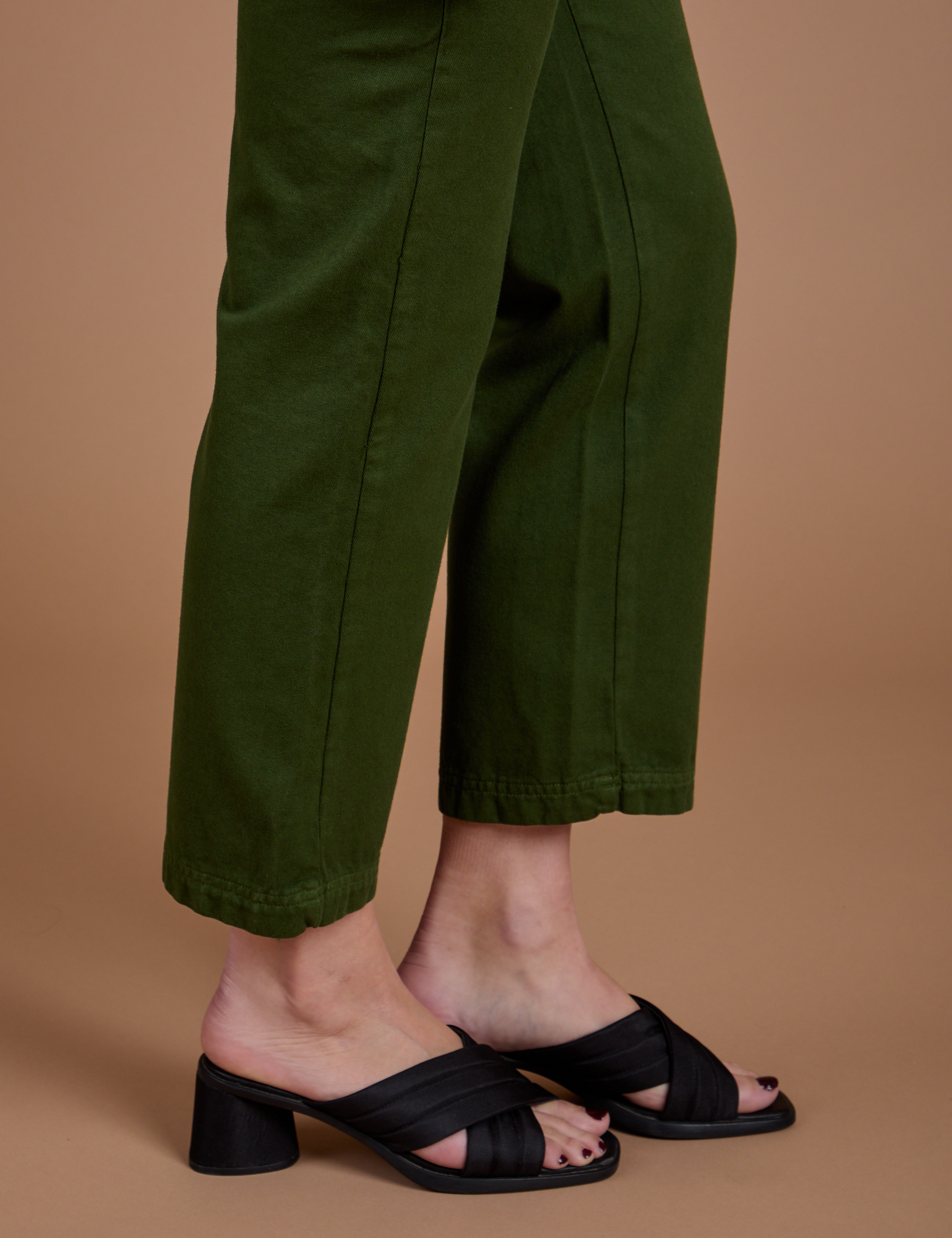 Organic Work Pants in Evergreen pant leg close up on Alex