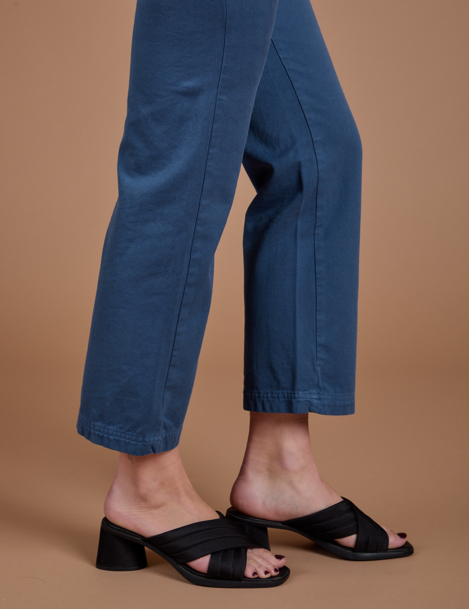 Side Organic Work Pants in French Blue pant leg close up on Alex