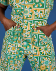 Close up of Kandia's hands in the front pockets of Spring Quilt Print Jumpsuit