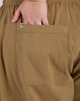 Close up of Juliet's hand in the back pocket of Drop Pocket Cargo Pants in Desert Brown