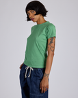 Jr. Varsity Tee in Seafoam Green angled front view on Kira