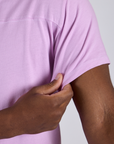 Close up of Jr. Varsity Tee in Lilac Purple sleeve on Isaac