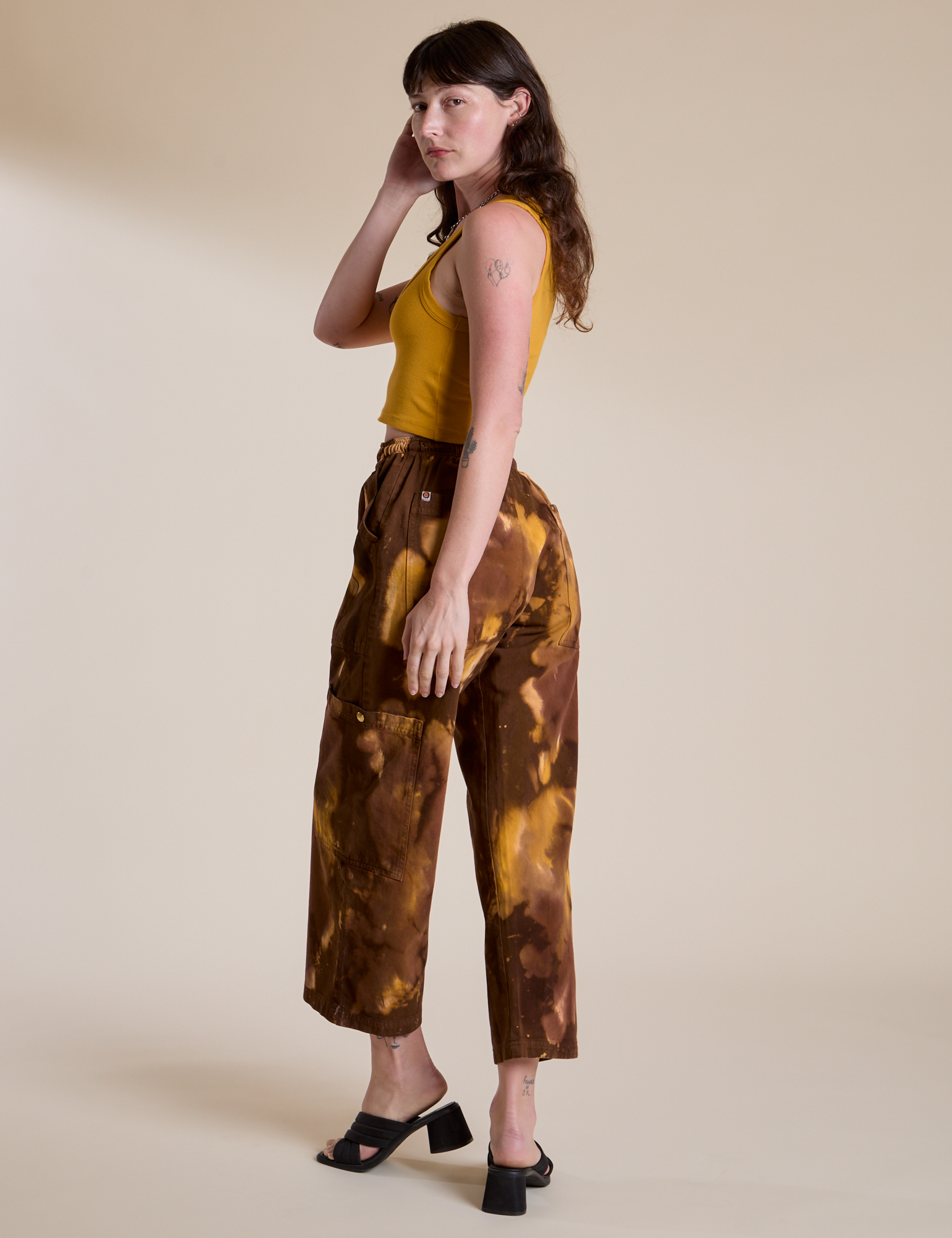 Angled back view of Magic Waters Drop Pocket Pants in Honey Brown on Alex