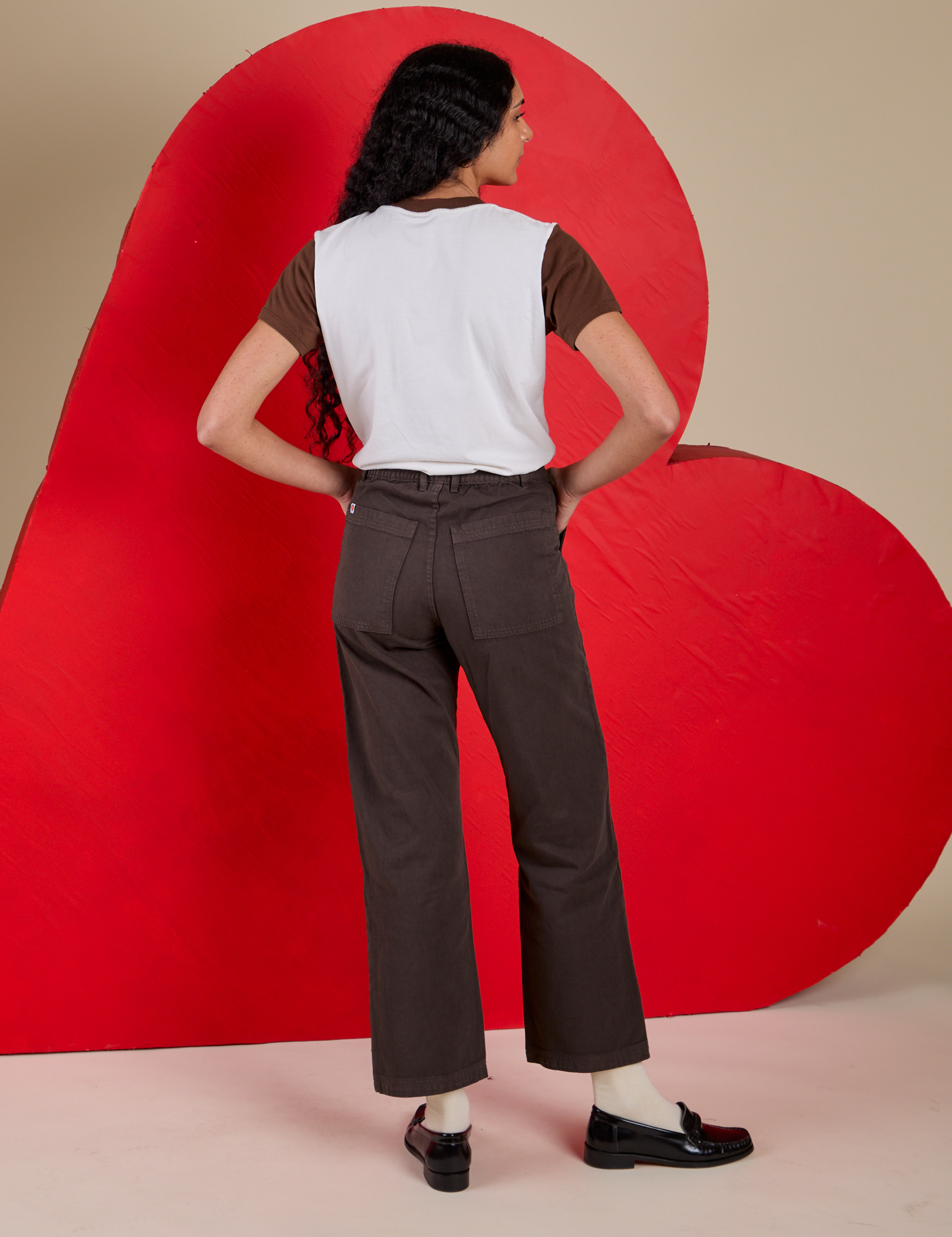 Back view of Vintage Tee in Love Big Bud and fudgesicle Work Pants on Shahana