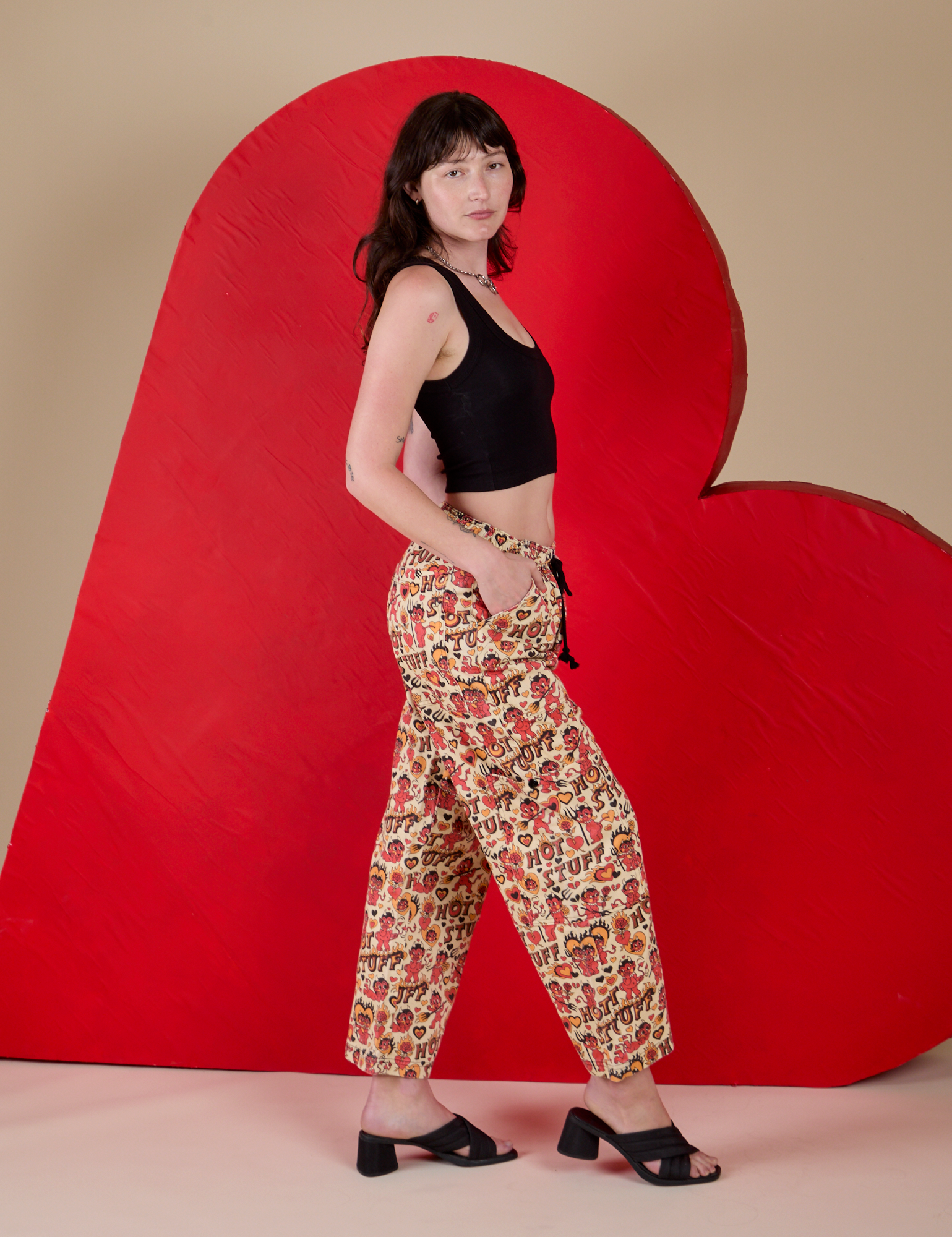 Hot Stuff Drop Pocket Cargo Pants and black Cropped Tank side view on Alex