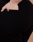 Close up of Ashley's hand in the back pocket of Classic Work Shorts in Basic Black