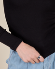 Long Sleeve Baby Tee in Basic Black bottom close up on Alex