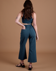 Action Pants in Lagoon back view on Alex