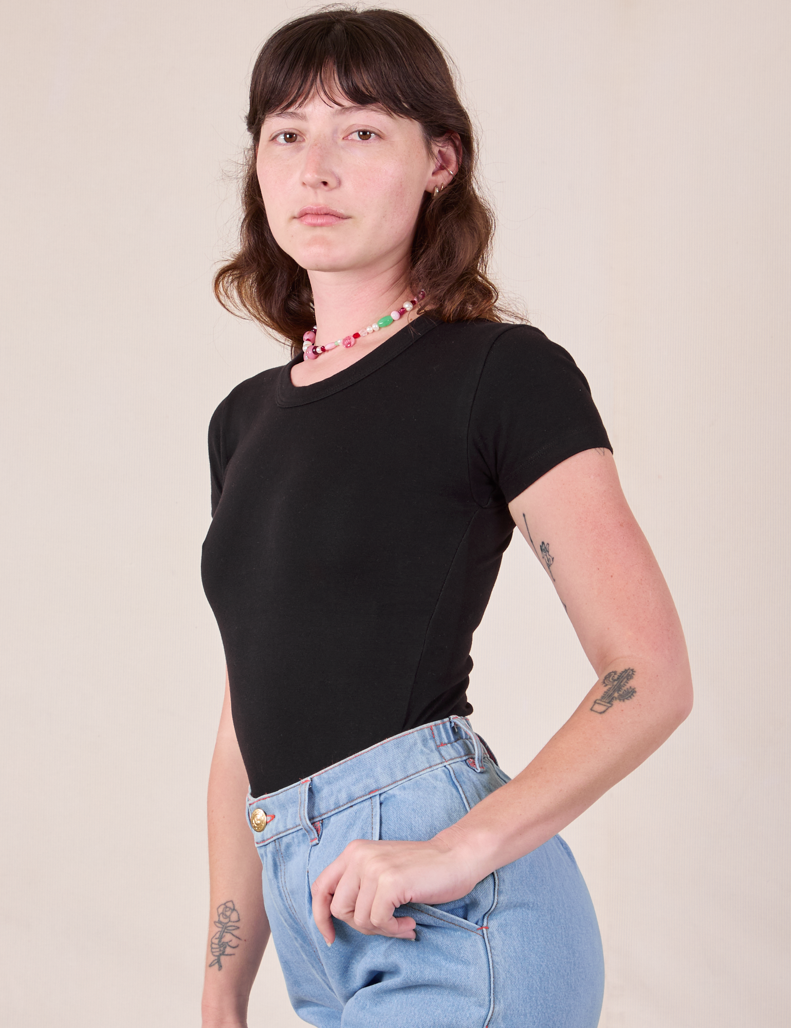 Baby Tee in Vintage Basic Black side view on Alex