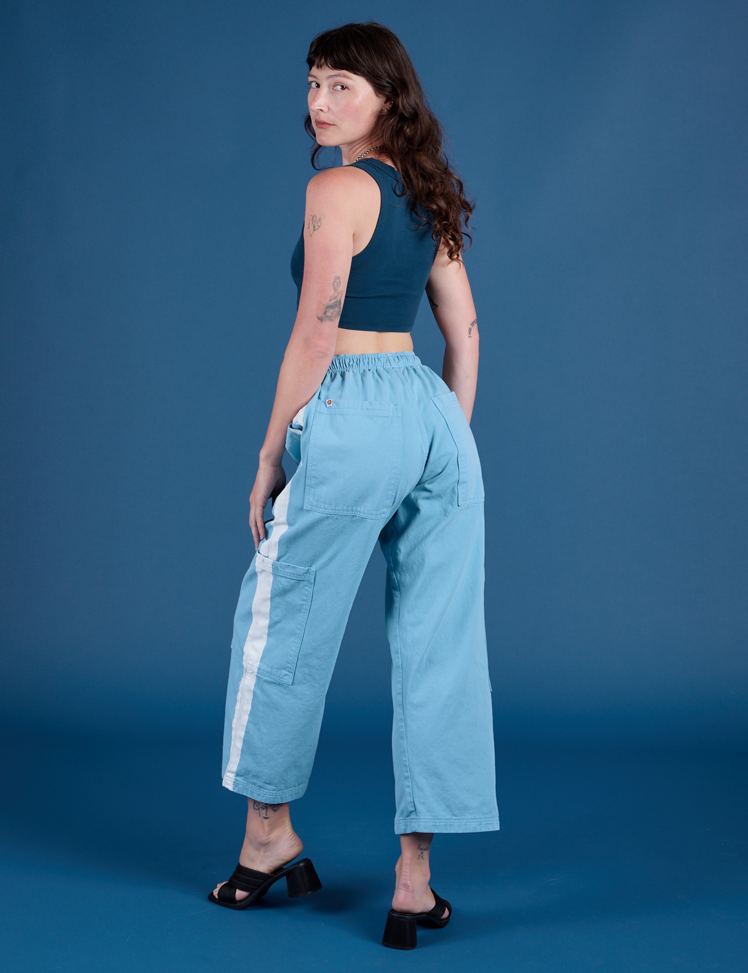 Painted Drop Pocket Cargo Pants in Baby Blue angled back view on Alex