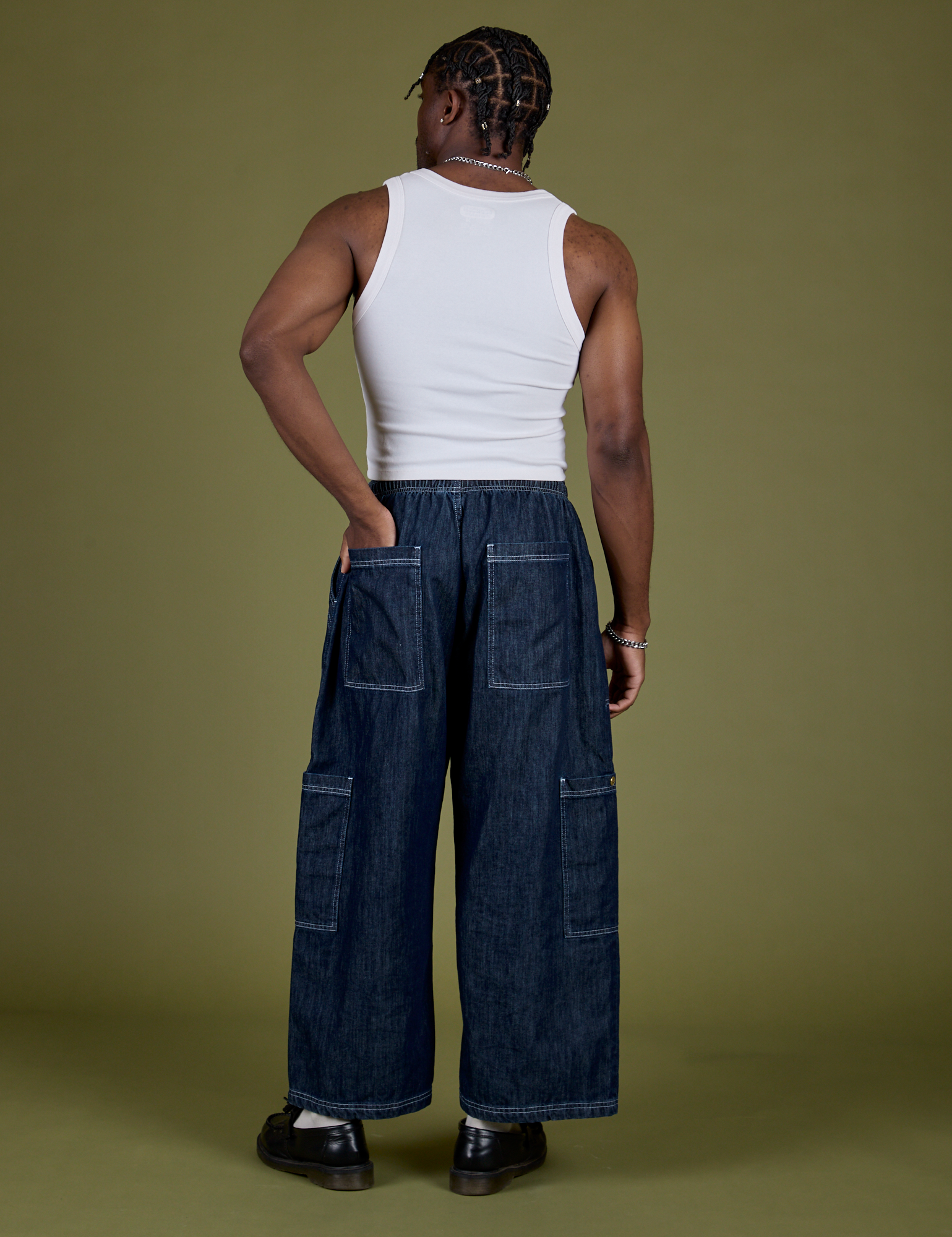Back view of Denim Drop Pocket Pants in Dark Wash and Cropped Tank in Vintage Tee White on Isaac