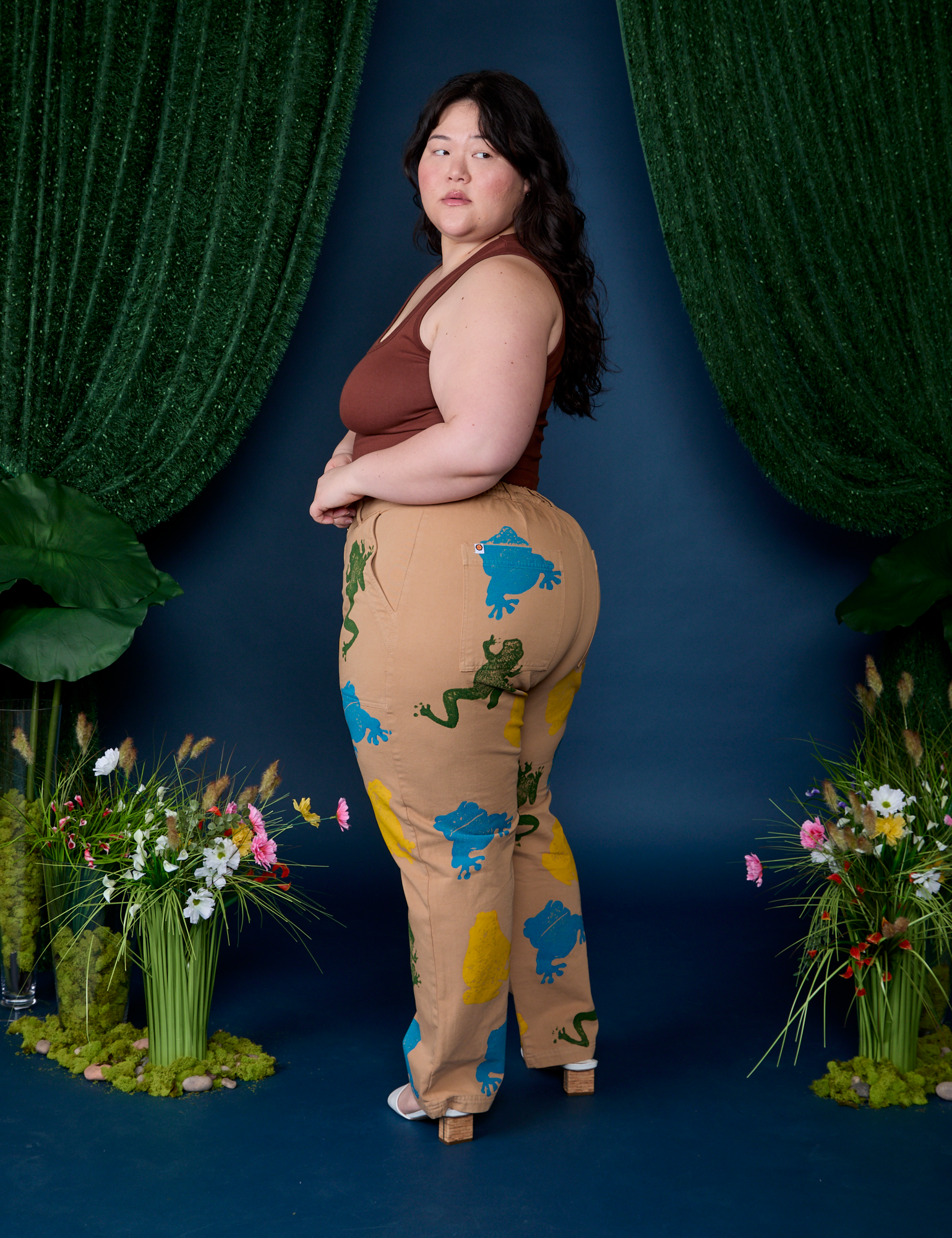 Angled back view of Paintstamped Work Pants in Froggy on Ashley