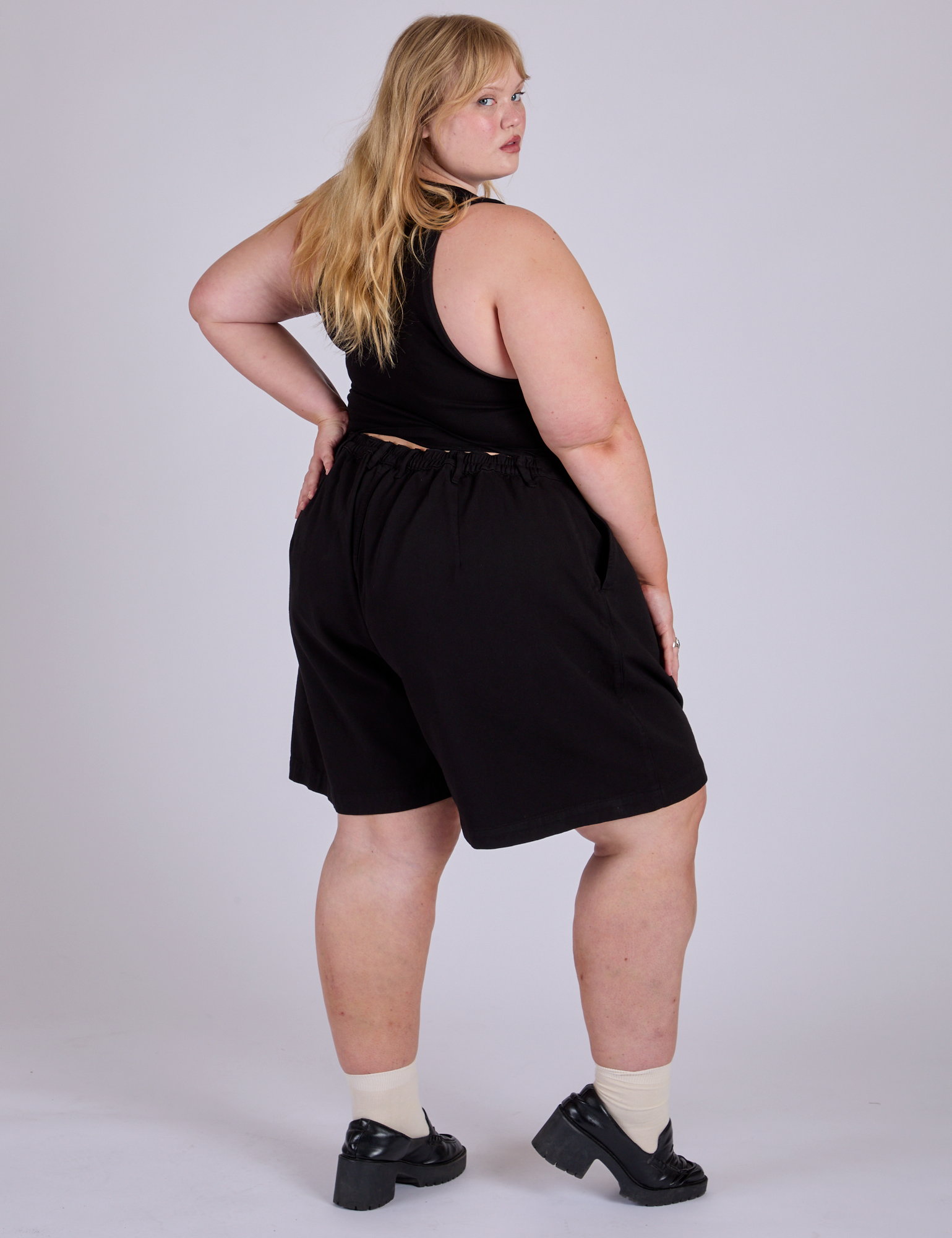 Pleated Trouser Shorts in Basic Black back front view on Juliet
