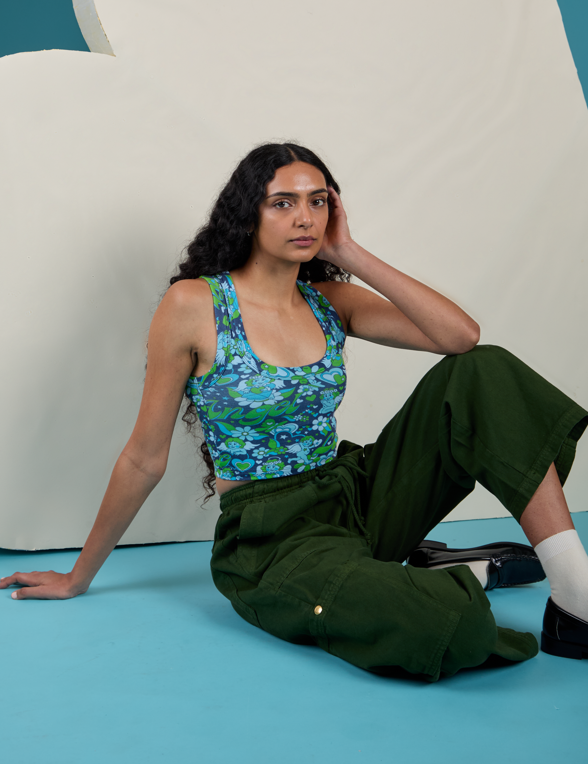 Cropped Tank Top in Angel Print and evergreen Drop Pocket Cargo Pants worn by Shahana