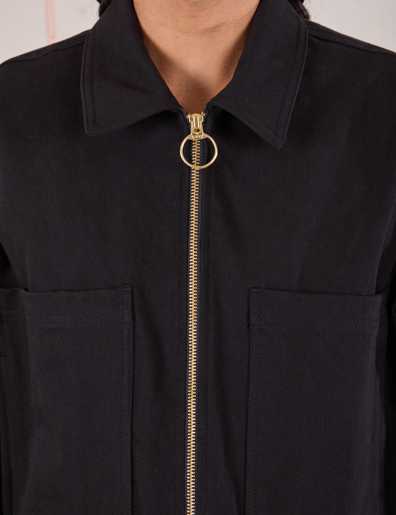 Mechanic Jacket in Basic Black front close up of brass zipper