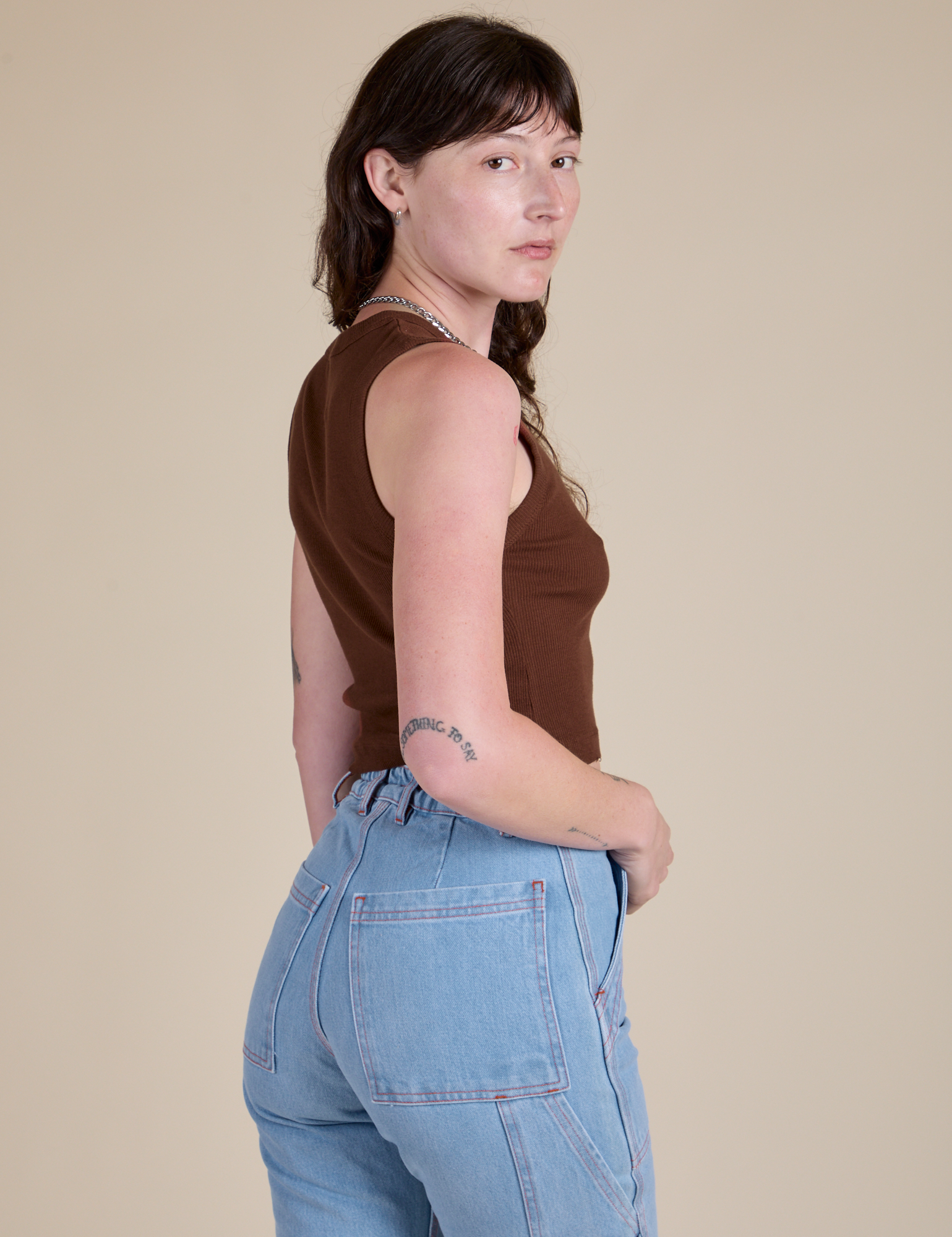 Muscle Tee in Fudgesicle Brown side view on Alex