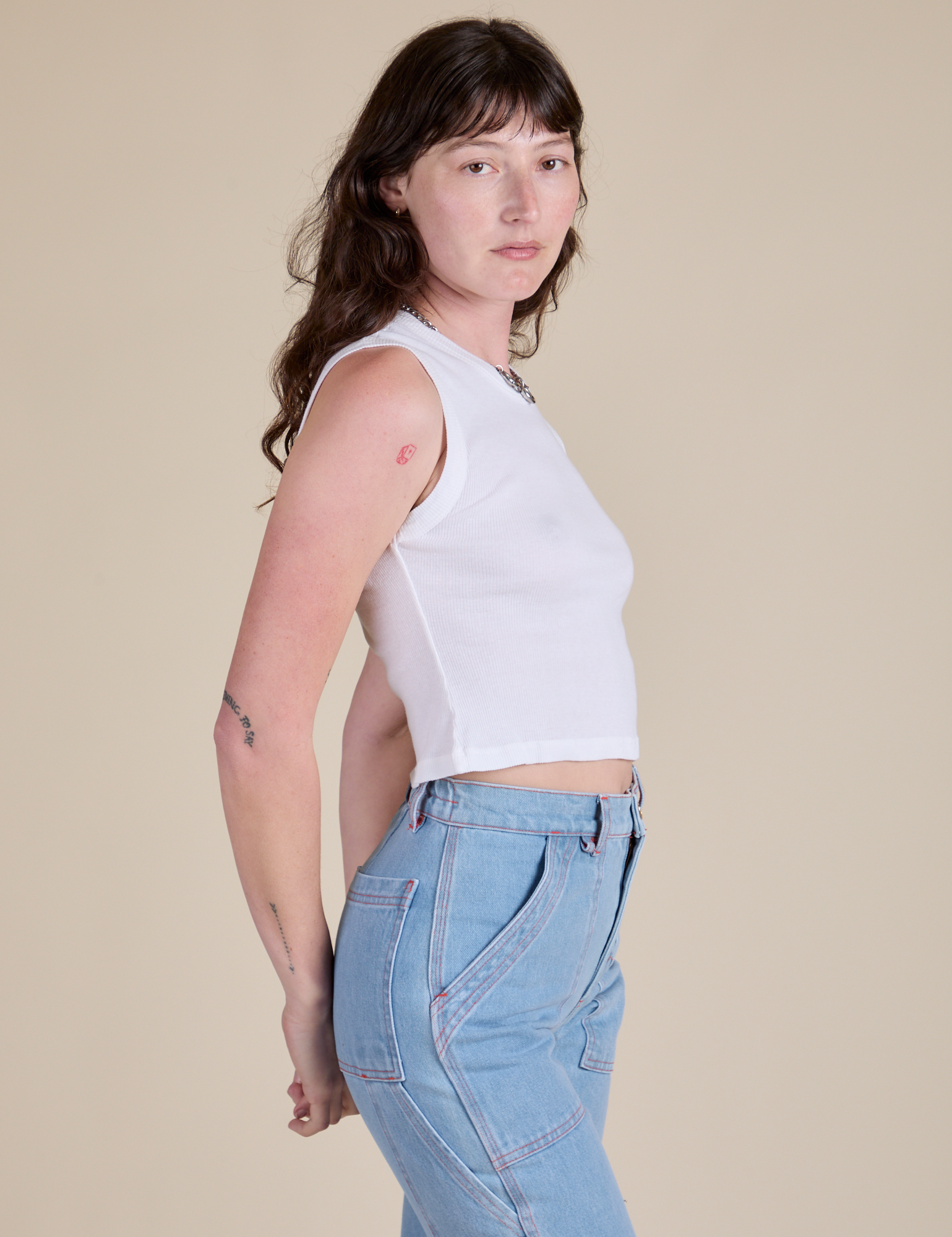Muscle Tee in Vintage Tee White side view on Alex