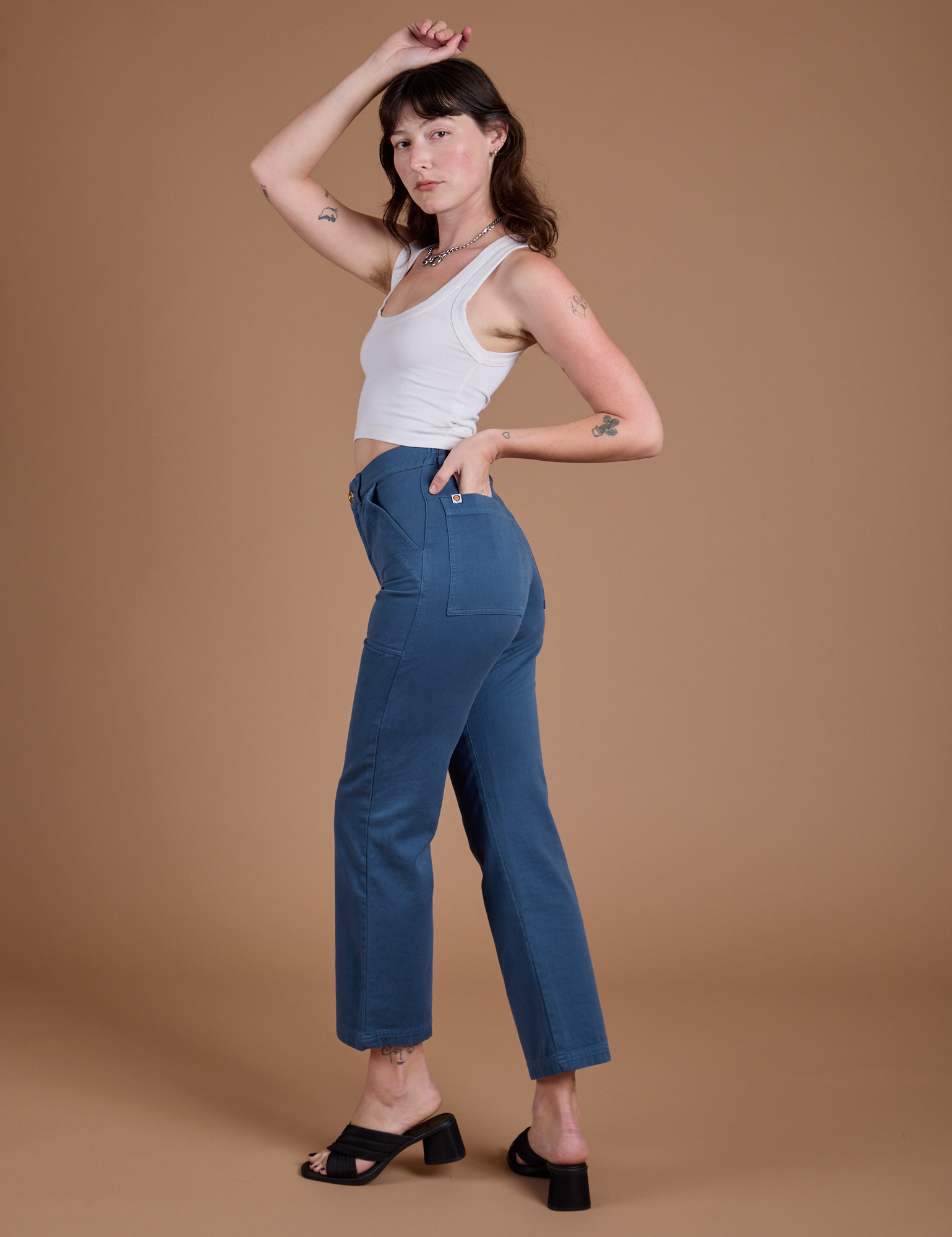 Angled back view of Organic Work Pants in French Blue on Alex