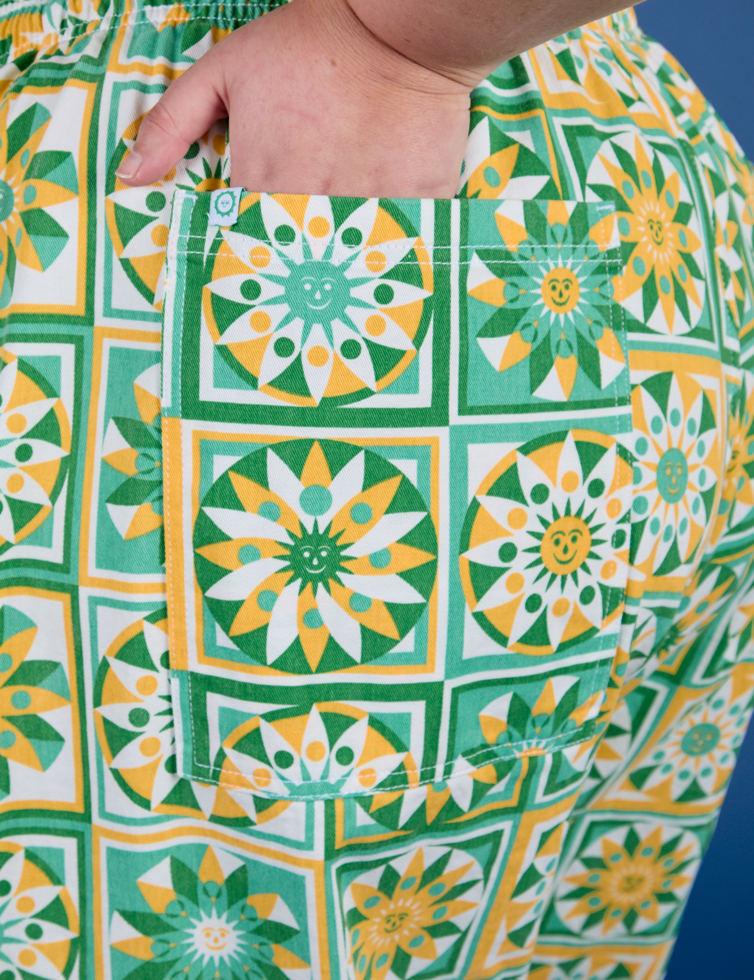 Close up of Juliet's hand in the back pocket of Drop Pocket Cargo Pants in Spring Quilt Print