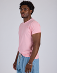 Jr. Varsity Tee in Baby Pink side view on Isaac