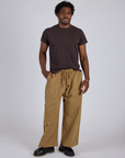 Isaac is 5’10” and wearing M Drop Pocket Cargo Pants in Desert Brown paired with espresso brown Organic Vintage Tee