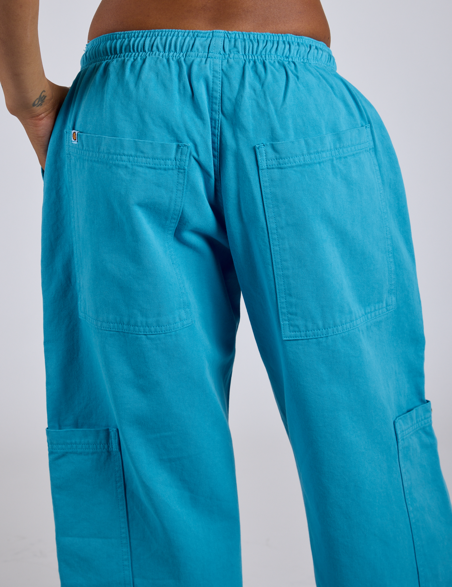 Close up back view of Drop Pocket Cargo Pants in Hawaiian Blue on Kira