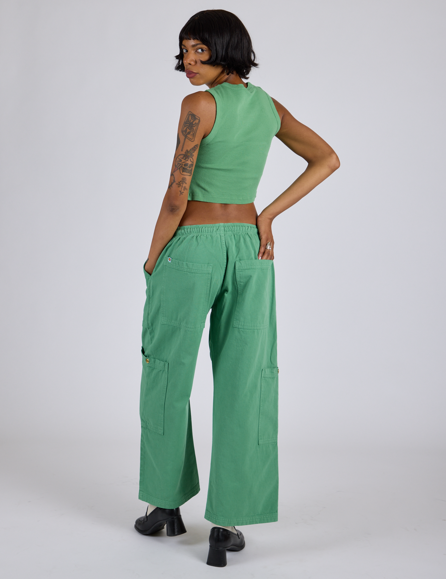 Back view of Drop Pocket Cargo Pants in Seafoam Green and matching Muscle Tee in Kira
