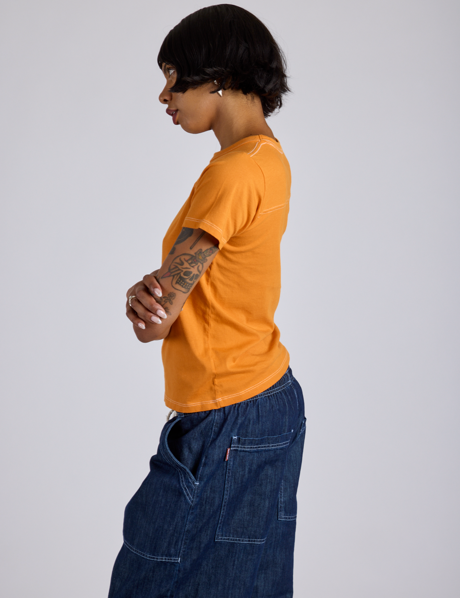 Jr. Varsity Tee in Creamsicle Orange side view on Kira
