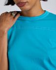Jr. Varsity Tee in Hawaiian Blue close up on Kira