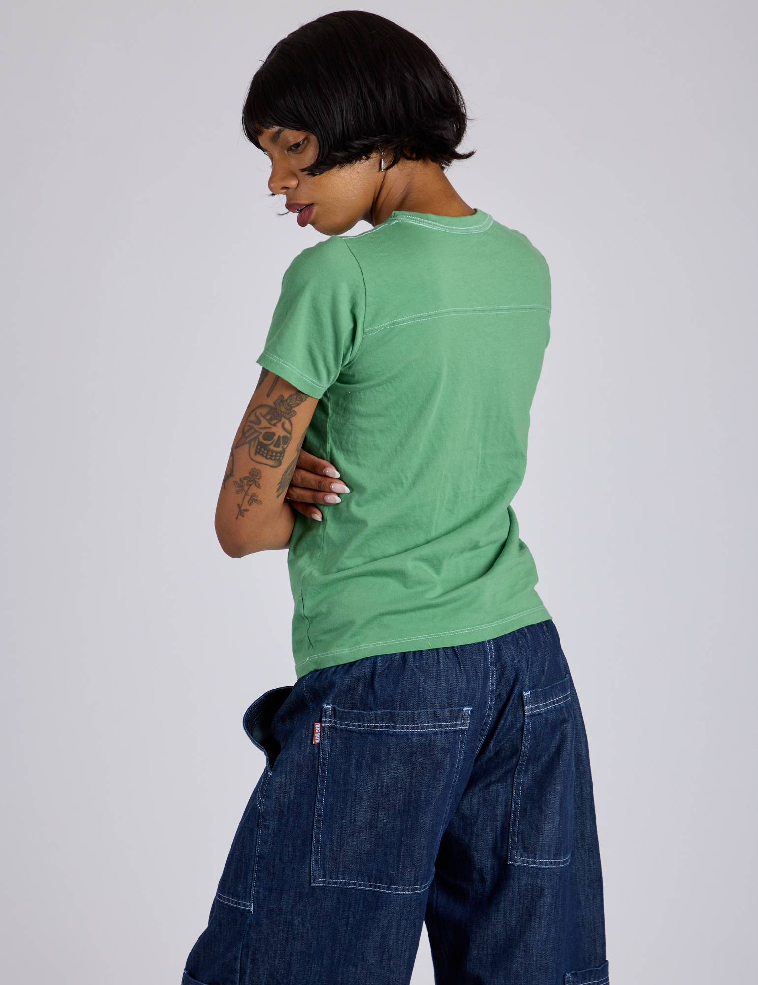 Jr. Varsity Tee in Seafoam Green angled back view on Kira
