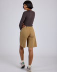 Back view of Longline Work Shorts in Desert Brown and espresso brown Long Sleeve Baby Tee on Kira