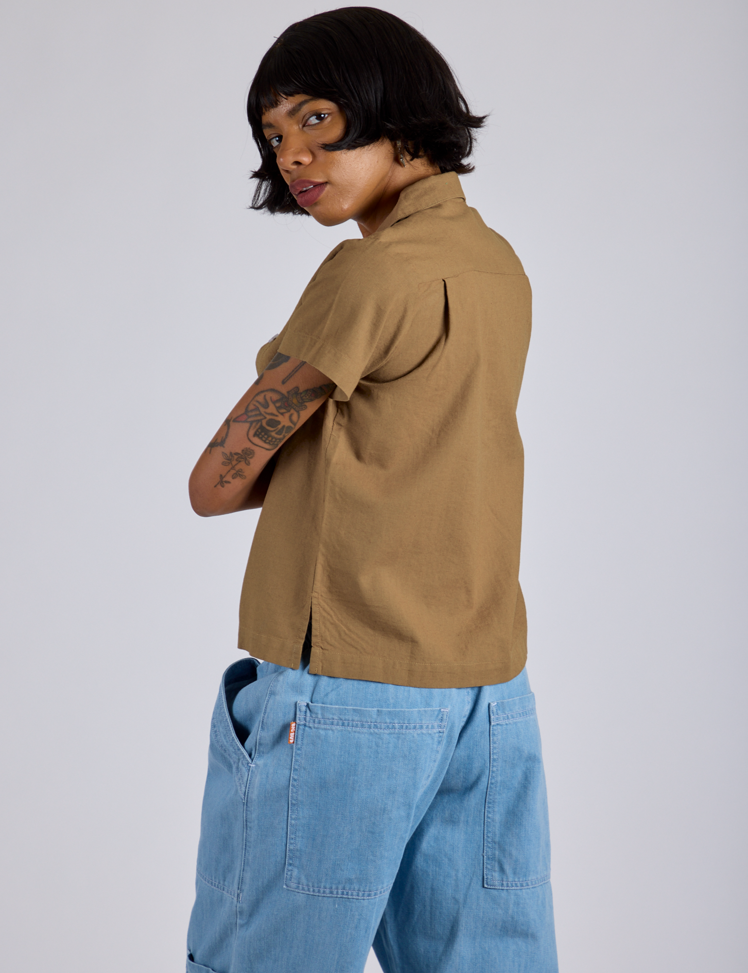 Pantry Button-Up in Desert Brown angled back view on Kira