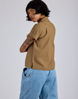 Pantry Button-Up in Desert Brown angled back view on Kira