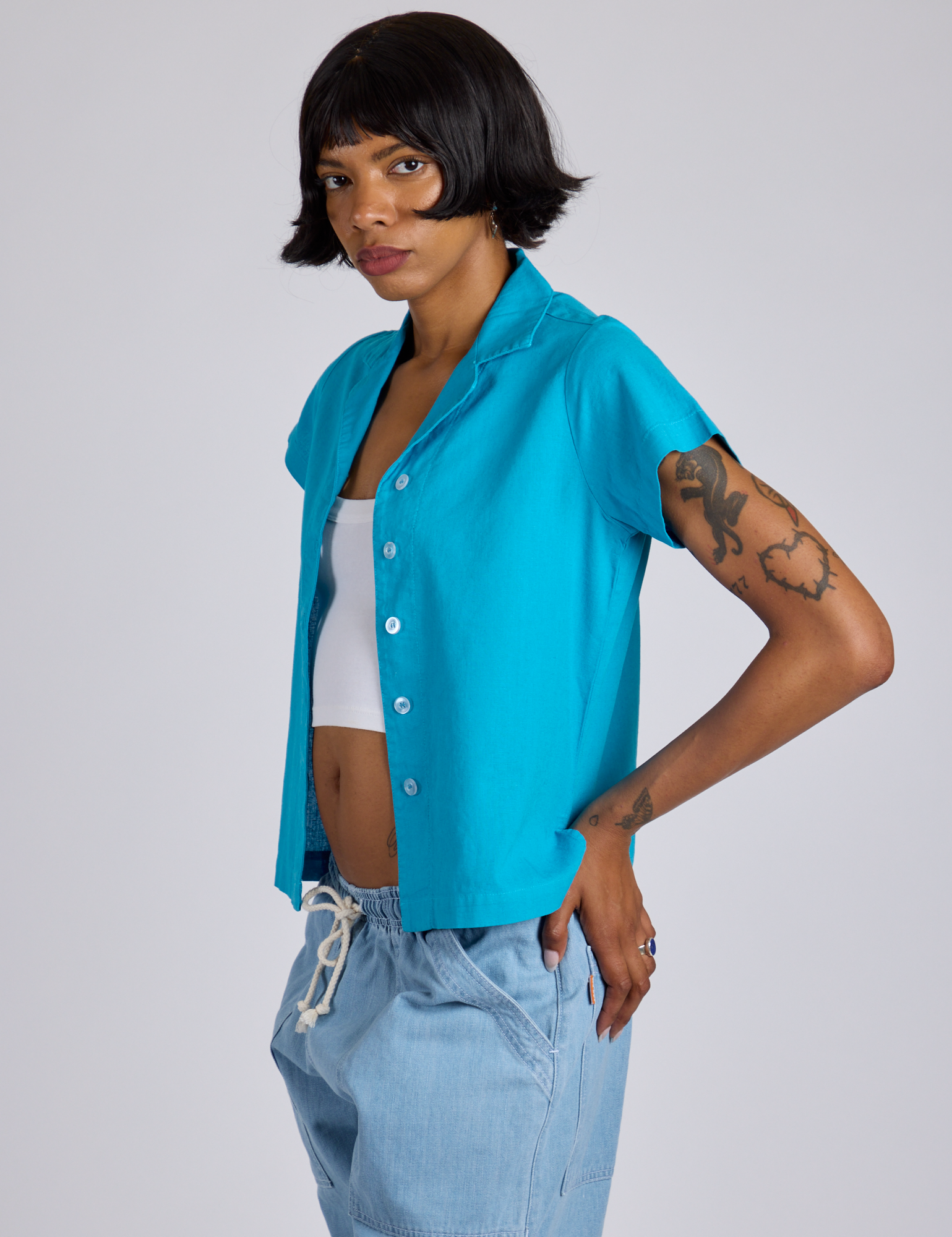 Angled front view of Pantry Button-Up in Hawaiian Blue on Kira
