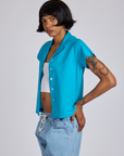Angled front view of Pantry Button-Up in Hawaiian Blue on Kira