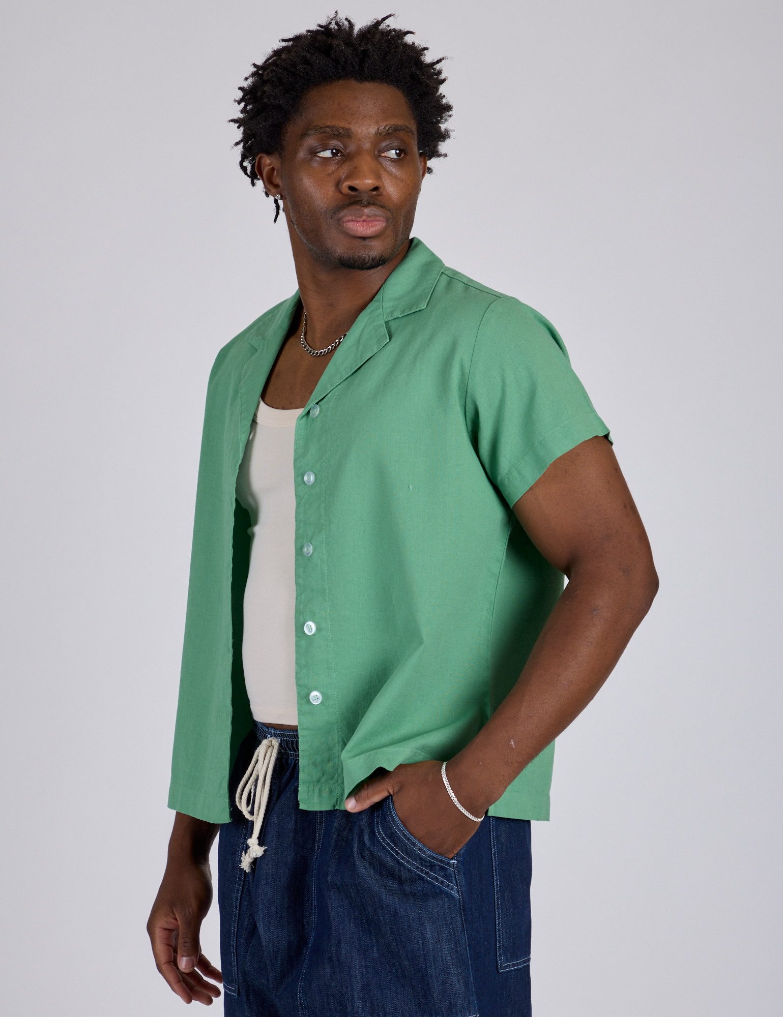 Angled front view of Pantry Button-Up in Seafoam Green on Isaac