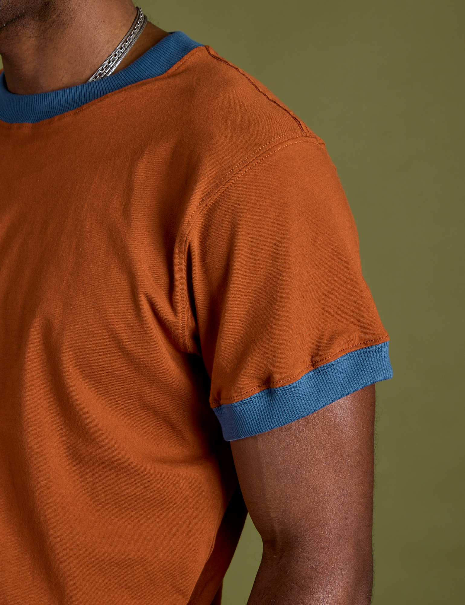 Close up of Vintage Ringer Tee in Burnt Terracotta sleeve on Jerrod