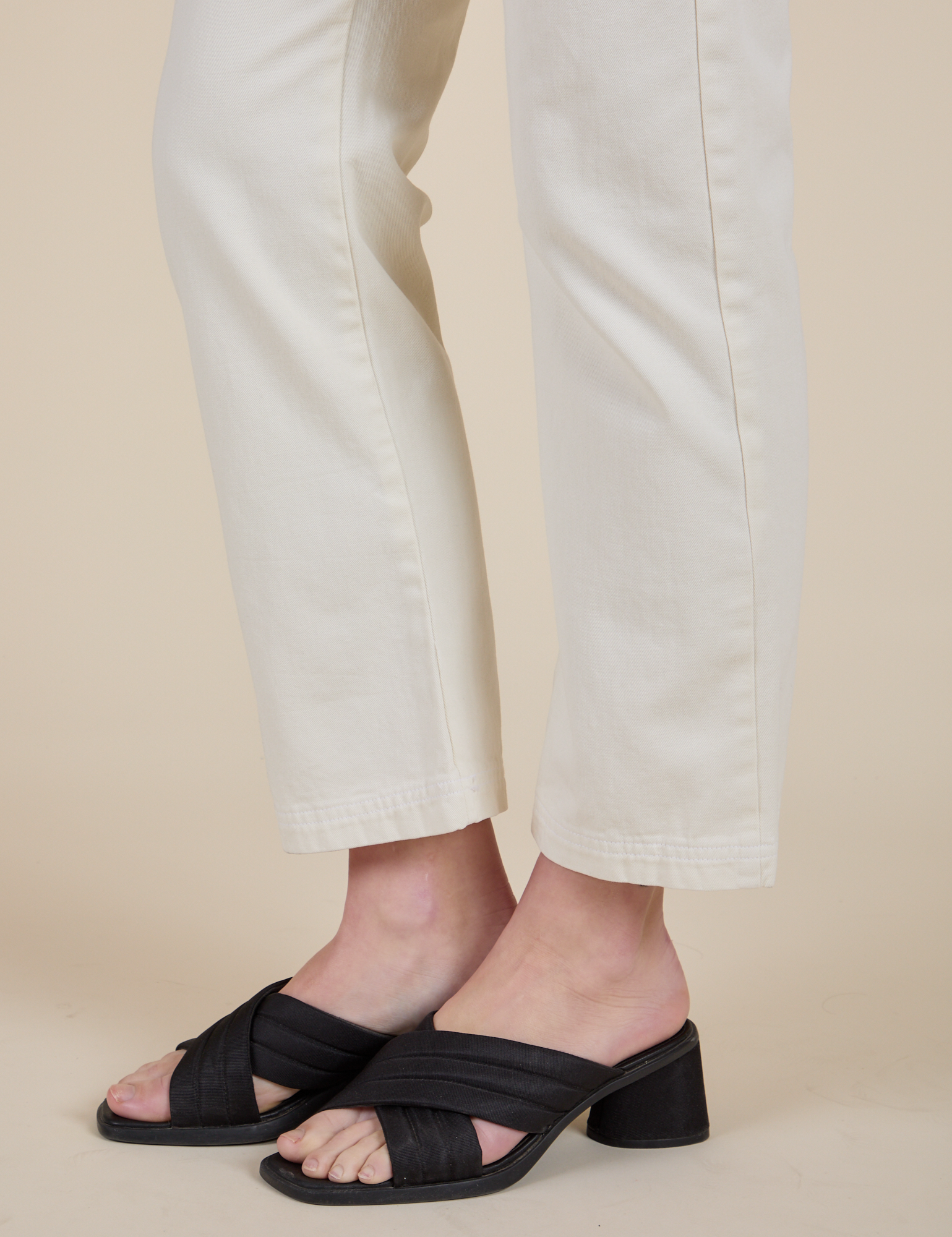 Short Sleeve Jumpsuit in Vintage Tee White pant leg side view close up