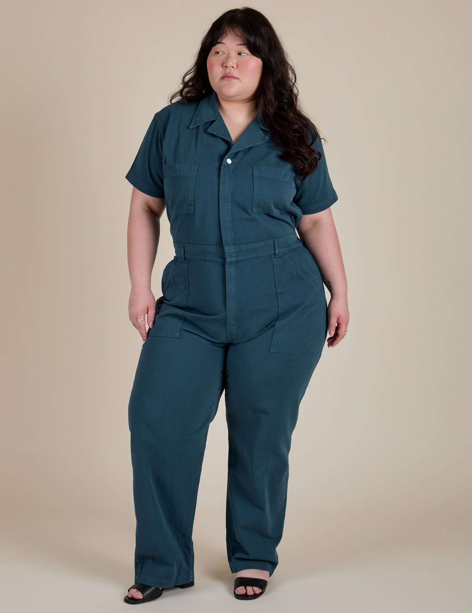 Ashley is 5'7" and wearing 1XL Short Sleeve Jumpsuit in Lagoon