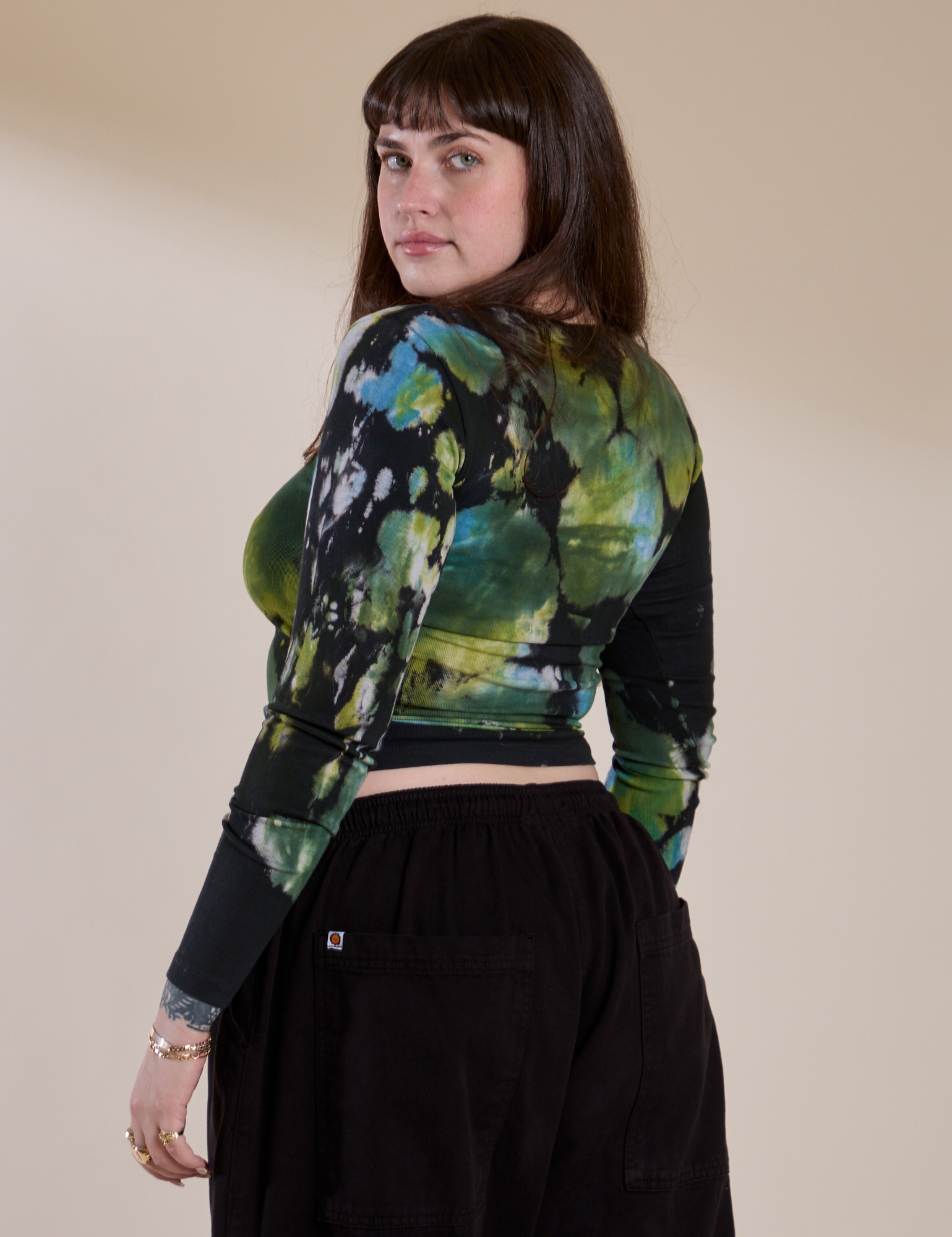 Angled back view of Long Sleeve Baby Tee in Green Pool on Sydney