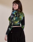 Angled back view of Long Sleeve Baby Tee in Green Pool on Sydney