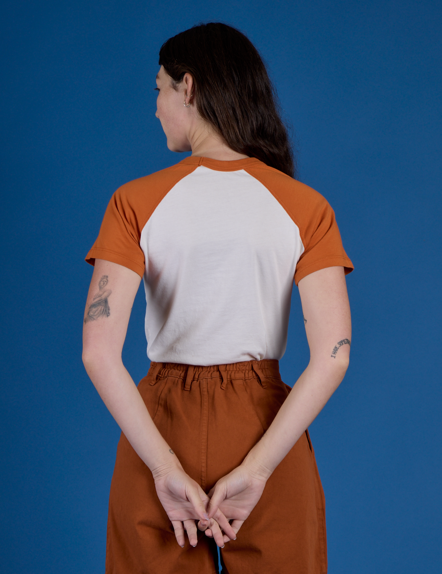 Back view of Produce Raglan Tee in Habanero on Alex