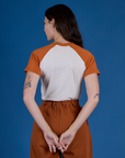 Back view of Produce Raglan Tee in Habanero on Alex