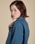 Side shoulder close up of Denim Work Jacket in French Blue on Hana