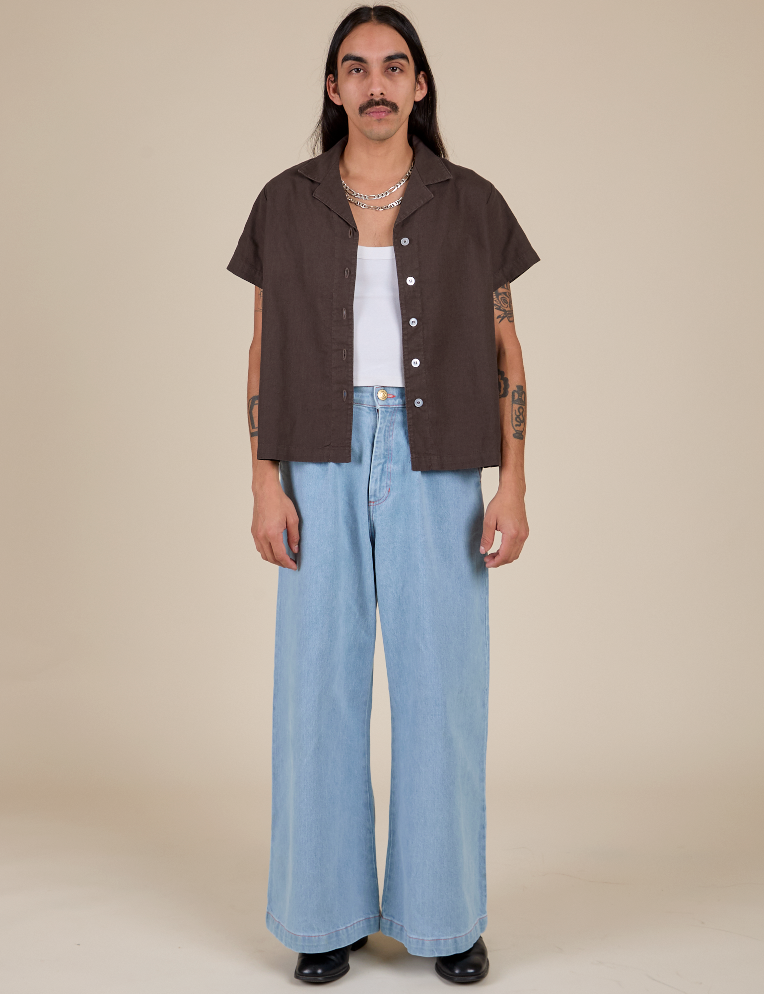 Anthony is wearing Pantry Button-Up in Espresso Brown and light wash Indigo Wide Leg Trousers
