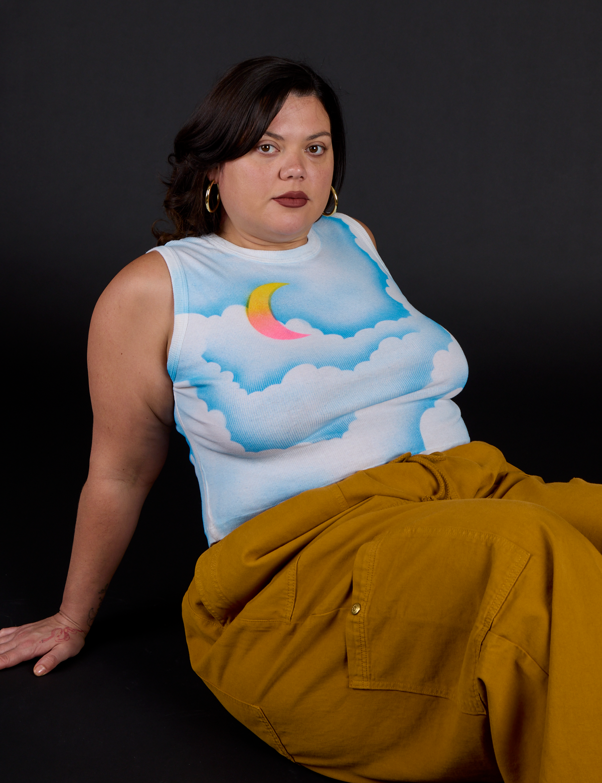 Kristen wearing the Morning Moon Airbrush Muscle Tee with Spicy Mustard Drop Pocket Cargo Pant