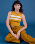 Alex is wearing Painted Muscle Tee in Mustard Yellow and spicy mustard Drop Pocket Cargo Pants